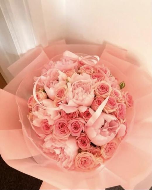 Pale pink peonies and spray roses in blush wrap
